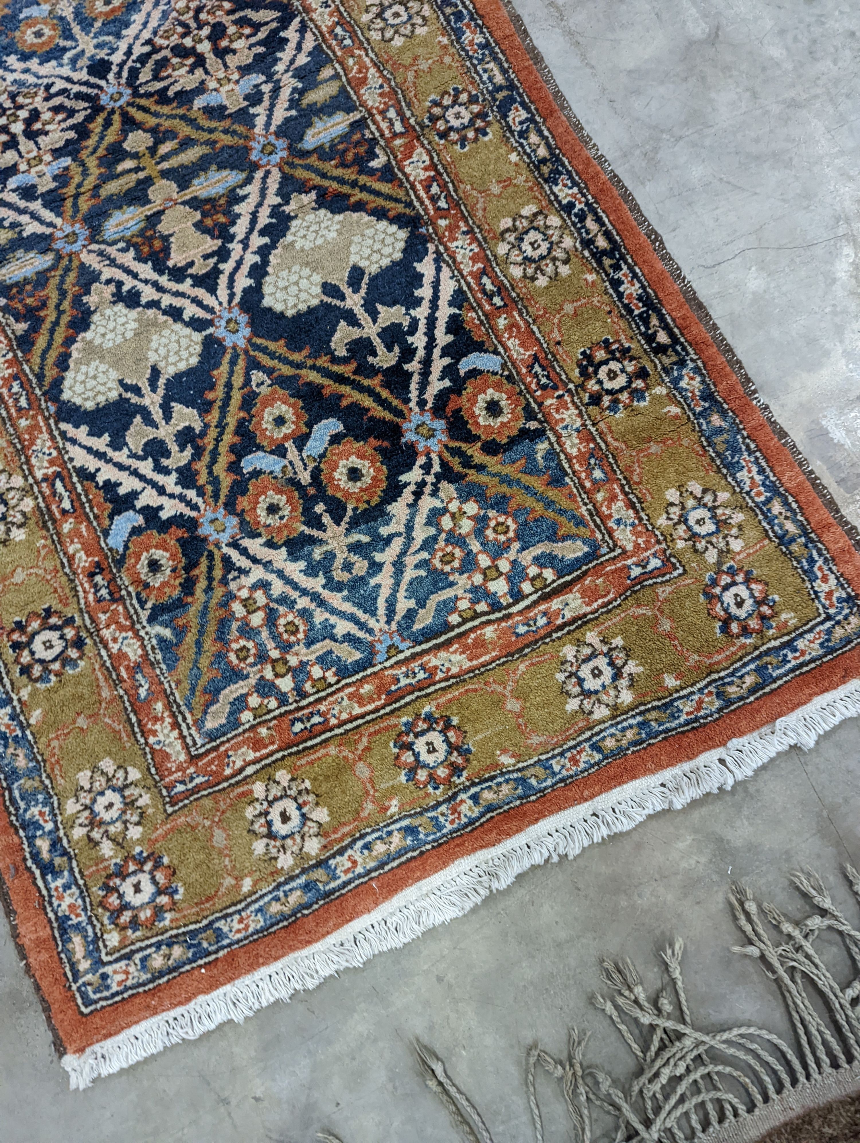 An Afghan brick red ground geometric runner and a smaller Afghan rug, larger 306 x 106cm